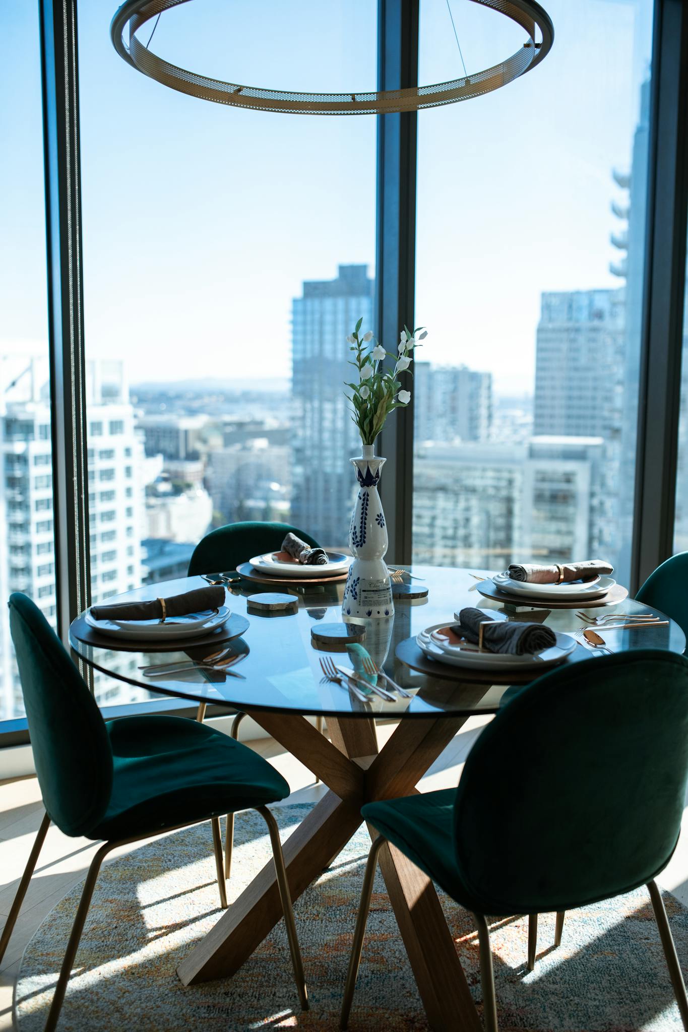 Chic dining table in a modern apartment overlooking the city skyline.